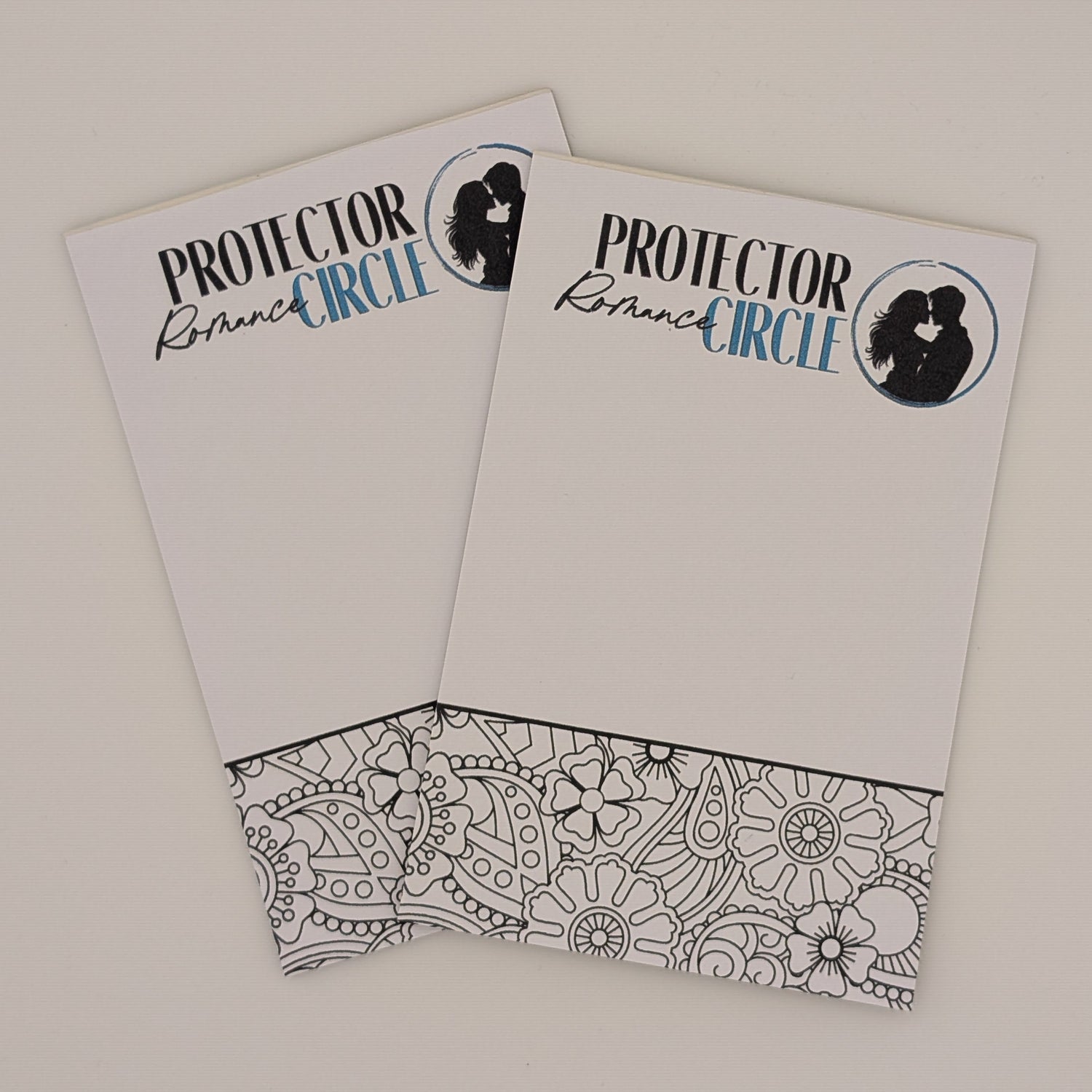 Two notepads with 'Protector Circle' text and logo in the header position and a floral and paisley coloring section in the footer on a white background.