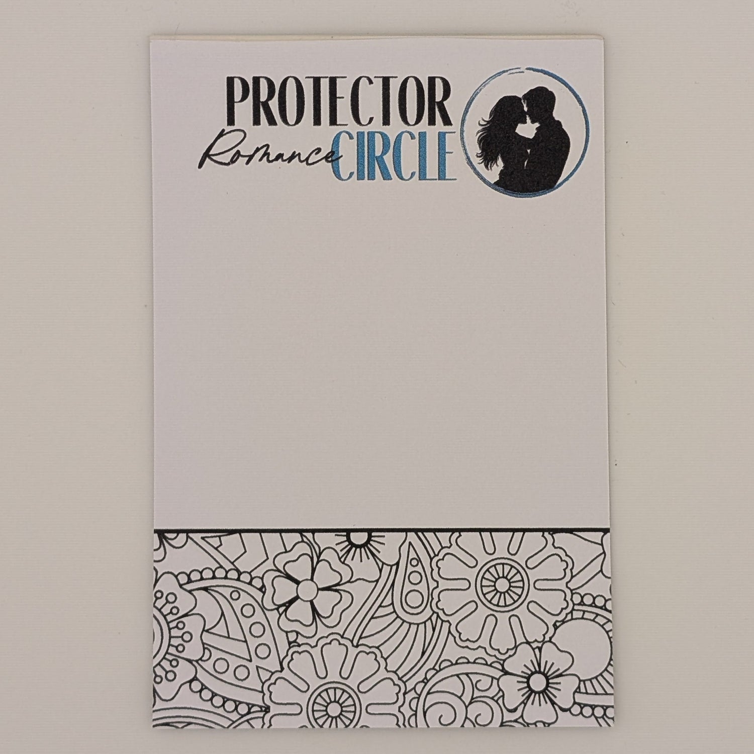Notepad with 'Protector Circle' branding on a plain background with a coloring section at the bottom